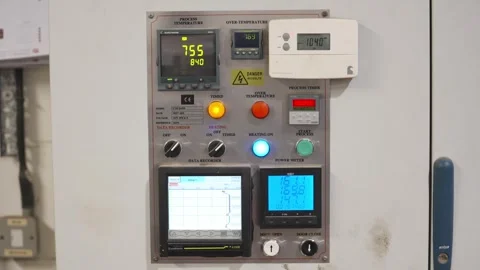 A white panel with a digital display showing the temperature Stock Footage 302456733