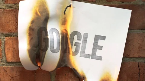 White paper A4 size burn, smoke on brick wall with word Google. Concept of war. Stock Footage 108756624