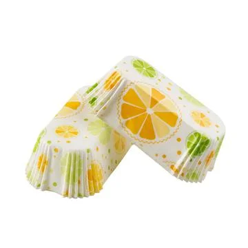White paper baking forms for cakes with citrus background pattern Stock Photos