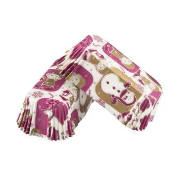 White paper baking forms for cakes with New Year background pattern Foto stock