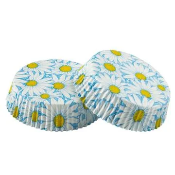 White paper baking forms for muffins and cupcakes with daisy flowers pattern Stock Photos