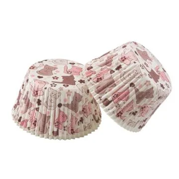 White paper baking forms for muffins and cupcakes with cats pattern Foto stock