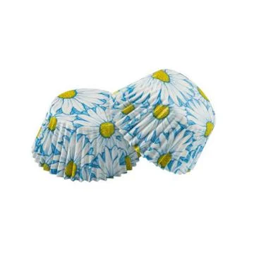 White paper baking forms for muffins and cupcakes with daisy flowers pattern Stock Photos