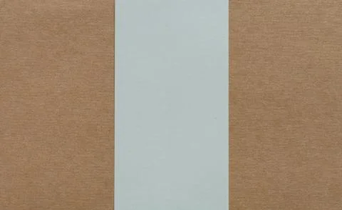 White paper on brown cardboad background Stock Photos