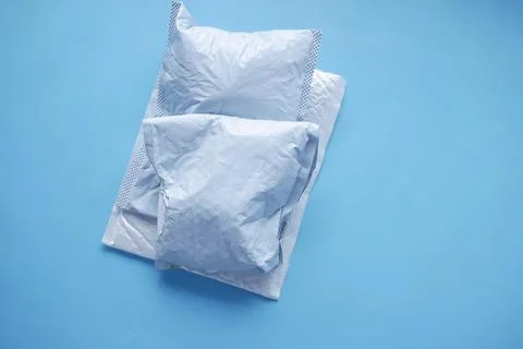 White paper bubble envelope on blue background Stock Photos