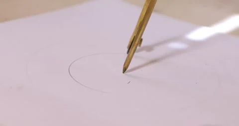 On white paper a compass draws a circle Stock Footage 310172818