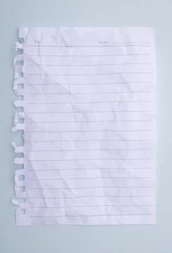 White paper with crumpled lines placed on a blue background Stock Photos