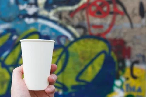 White paper cup on a colored background Stock Photos