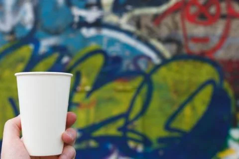 White paper cup on a colored background Stock Photos