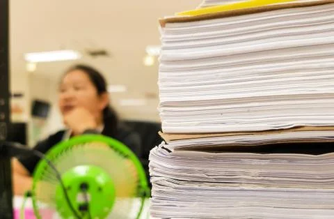 White paper document with blur working woman,office concept background Stock Photos