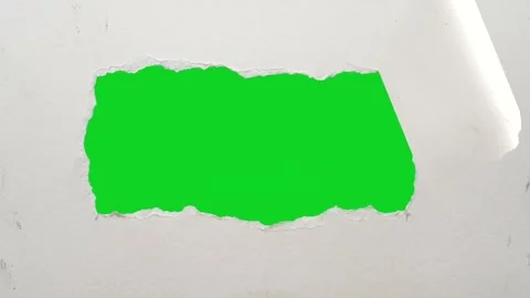 White paper jagged vertical peeling gap revealing animated on green screen Stock Footage 335216415