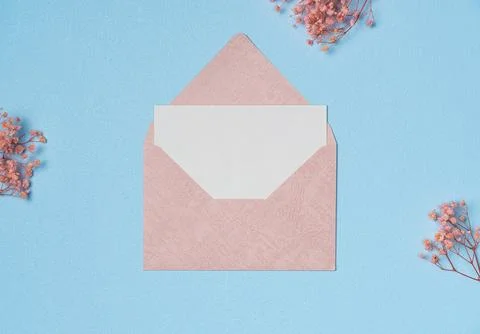 White paper list with envelope in a frame of flowers on blue background fro.. Stock Photos