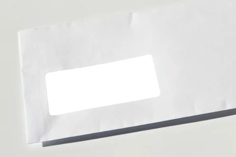 White paper mail rectangle envelope with address window on a white background Stock Photos