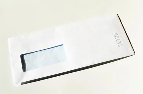 White paper mail rectangle envelope with address window on a white background Stock Photos