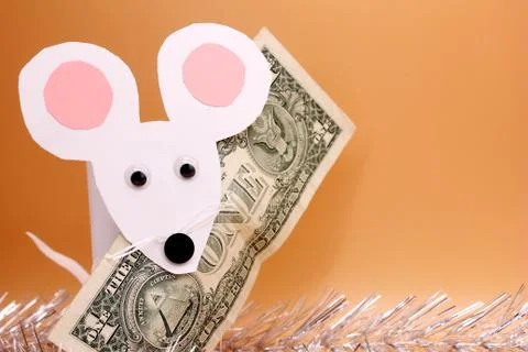 A white paper mouse and the U.S. dollardollar. Stock Photos