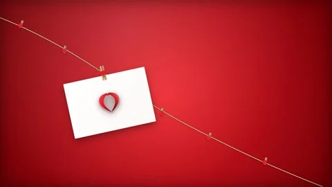 White Paper Note Hanging on String Against Vibrant Red Background. Stock Footage 341775346