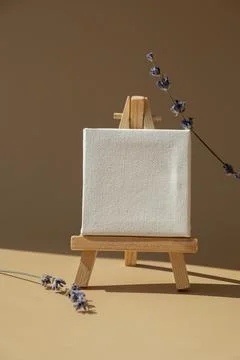 White paper note template mock up with dried lavender flower on neutral beige Stock Photos