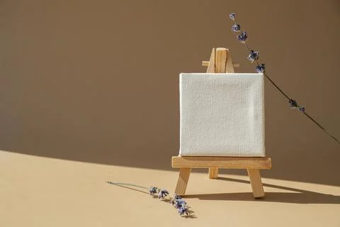 White paper note template mock up with dried lavender flower on neutral beige Stock Photos