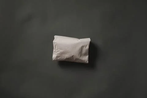 White paper roll on dark gray background Stock Photos