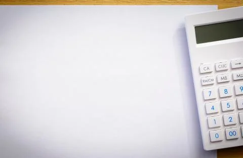 White paper sheet with calculator Stock Photos