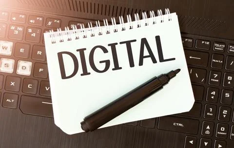 White paper sheet with text DIGITAL on the black laptop Stock Photos