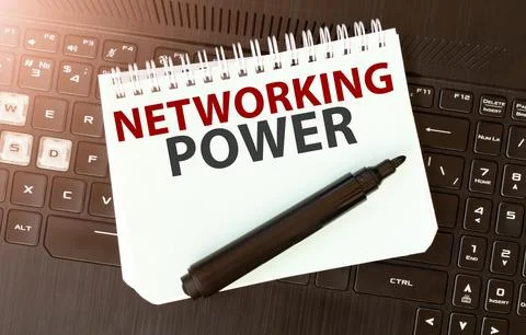 White paper sheet with text NETWORKING POWER on the black laptop Stock Photos