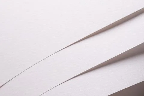 White paper sheets with soft diagonal shadows. Minimal textured stationery Stockfoto's