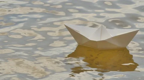 White Paper Ship is Drifting by River Watery Childish Amusement Game Dream Stock Footage 64774140