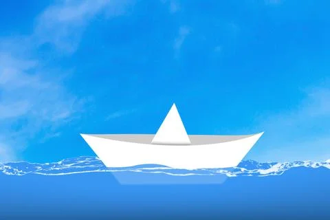 White Paper Ship Floating on Ocean Stock Photos