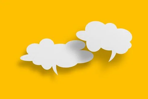 White paper in speech bubble shape set against yellow background. Stock Photos