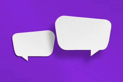White paper with speech bubbles isolated on purple background Stock Photos