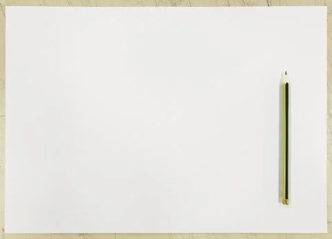 White paper on table and a single pencil on top. Top view background for idea Stock Photos