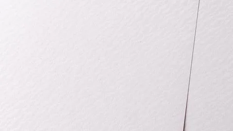 White paper texture with a soft matte finish and subtle wavy patterns. The Stock Photos