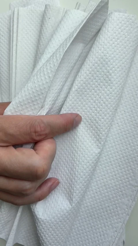 White paper towels moving in the wind for hygiene and household concept Stock Footage 338186359