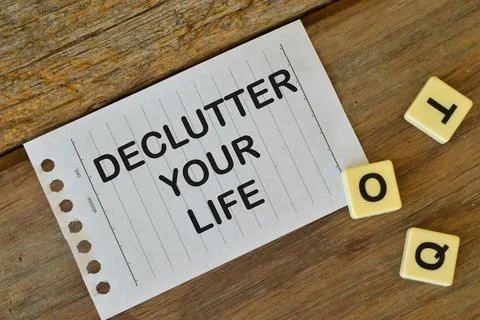 White paper written with text DECLUTTER YOUR LIFE Stock Photos