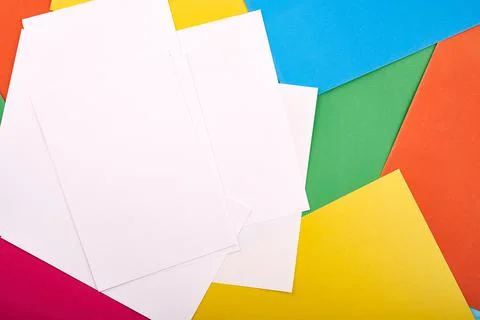 White papers for text on the background with colored cardboards. Preschool craft Stock Photos