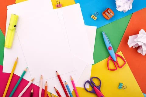 White papers for text on the background with colored cardboards. Preschool craft Stock Photos