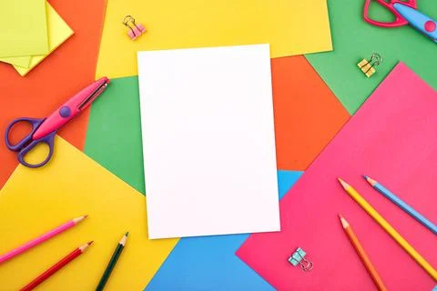 White papers for text on the background with colored cardboards. Preschool craft Stock Photos