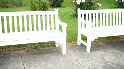 White park bench in a park Stock Footage 118083560