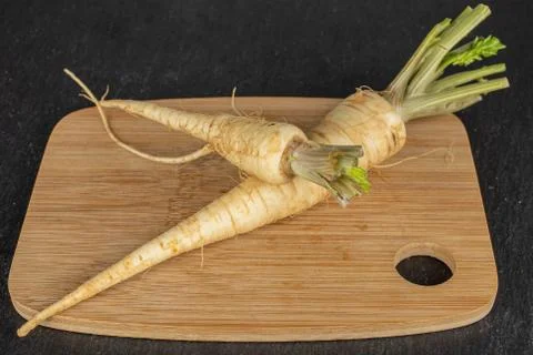 White parsley root on grey stone Stock Photos