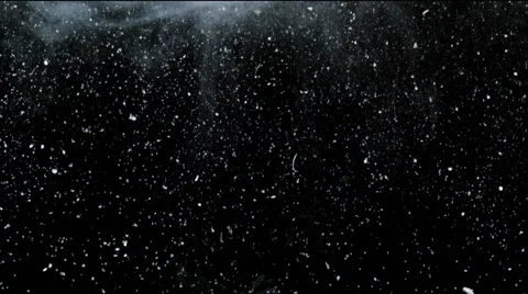 White particles and ink moving in space, slow motion, on black background Stock-Footage 43041148