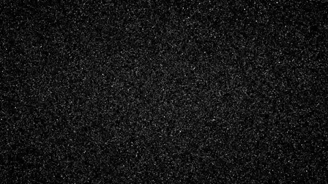 White Particles of Different Sizes on a Black Background Stock Footage 306538754