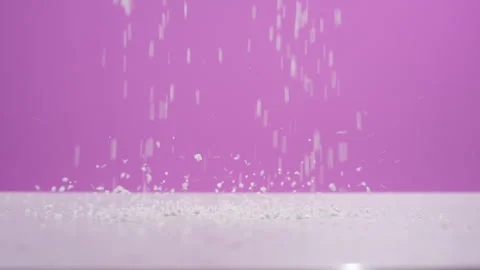 White Particles Falling Against Pink Purple Background Studio Stock Footage 340244994