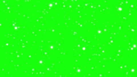 White particles floating gently against a vibrant green screen background for Stockbeeldmateriaal 344412820