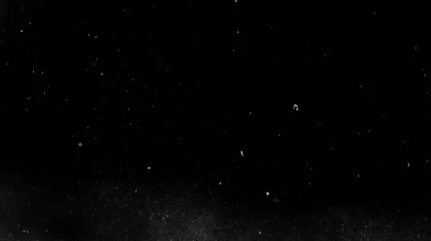 White particles floating slowly in on black background Stock Footage 56288970
