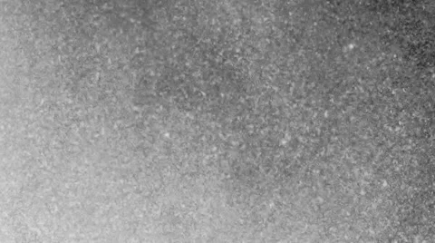 White particles floating slowly in space on black background Video stock 56287613