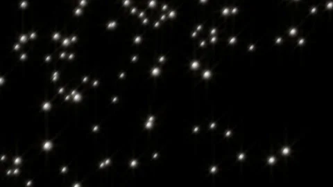 White Particles of Light Falling from Above at an Angle Video stock 327528720