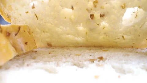 The white parts of the sliced bread on the table Stock Footage 135693877