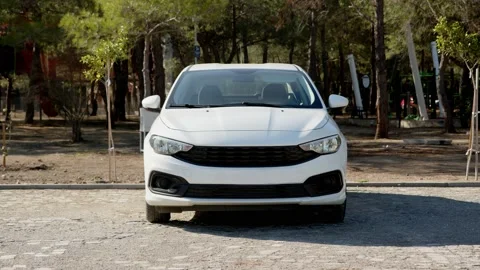 White passenger car without logos and identification marks stands parked in Stock-Footage 229398267