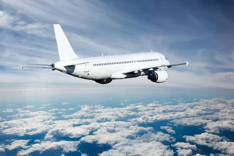 White passenger plane fly away. Back view of aircraft. Stock Photos